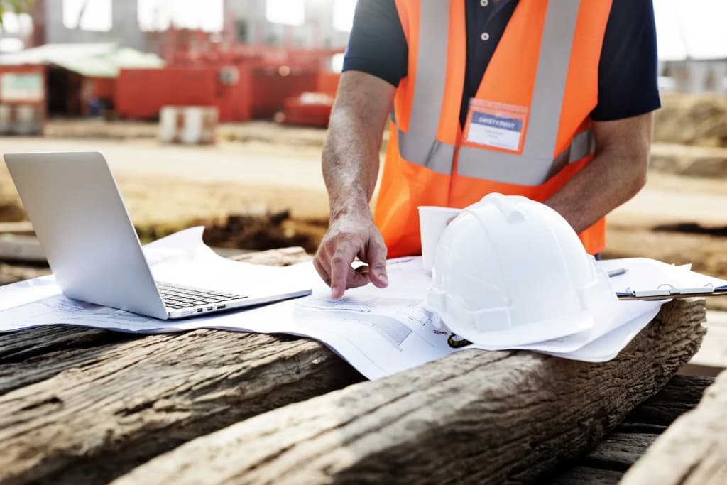 Framing contractor reviewing blueprints on a Northern California construction project