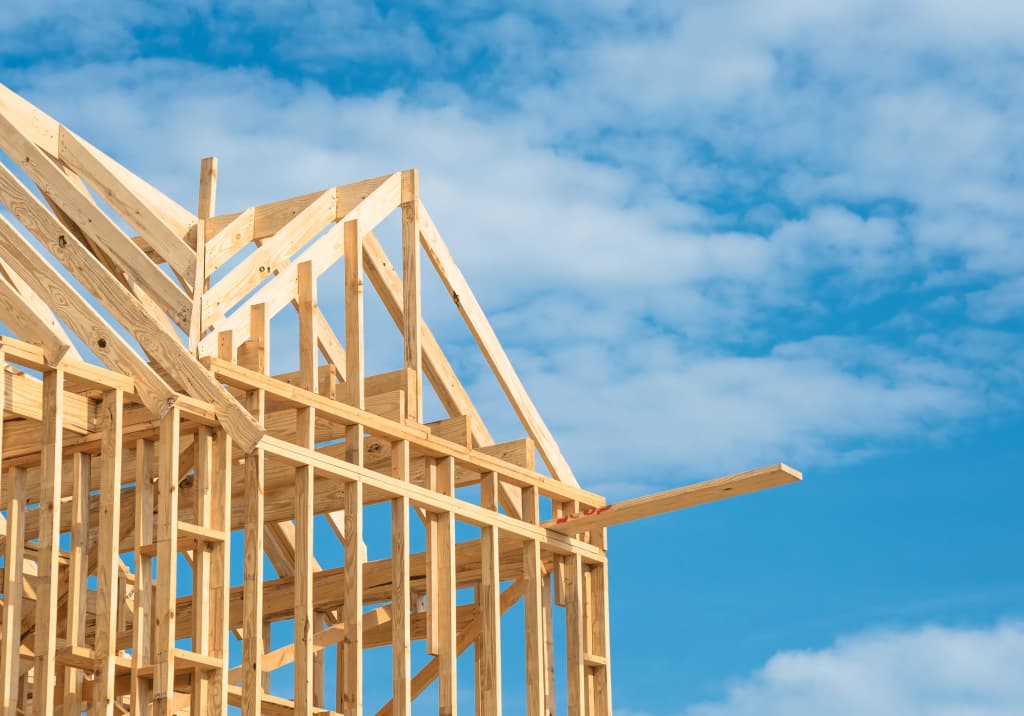 Residential wall framing against a clear blue sky on a Northern California new home build